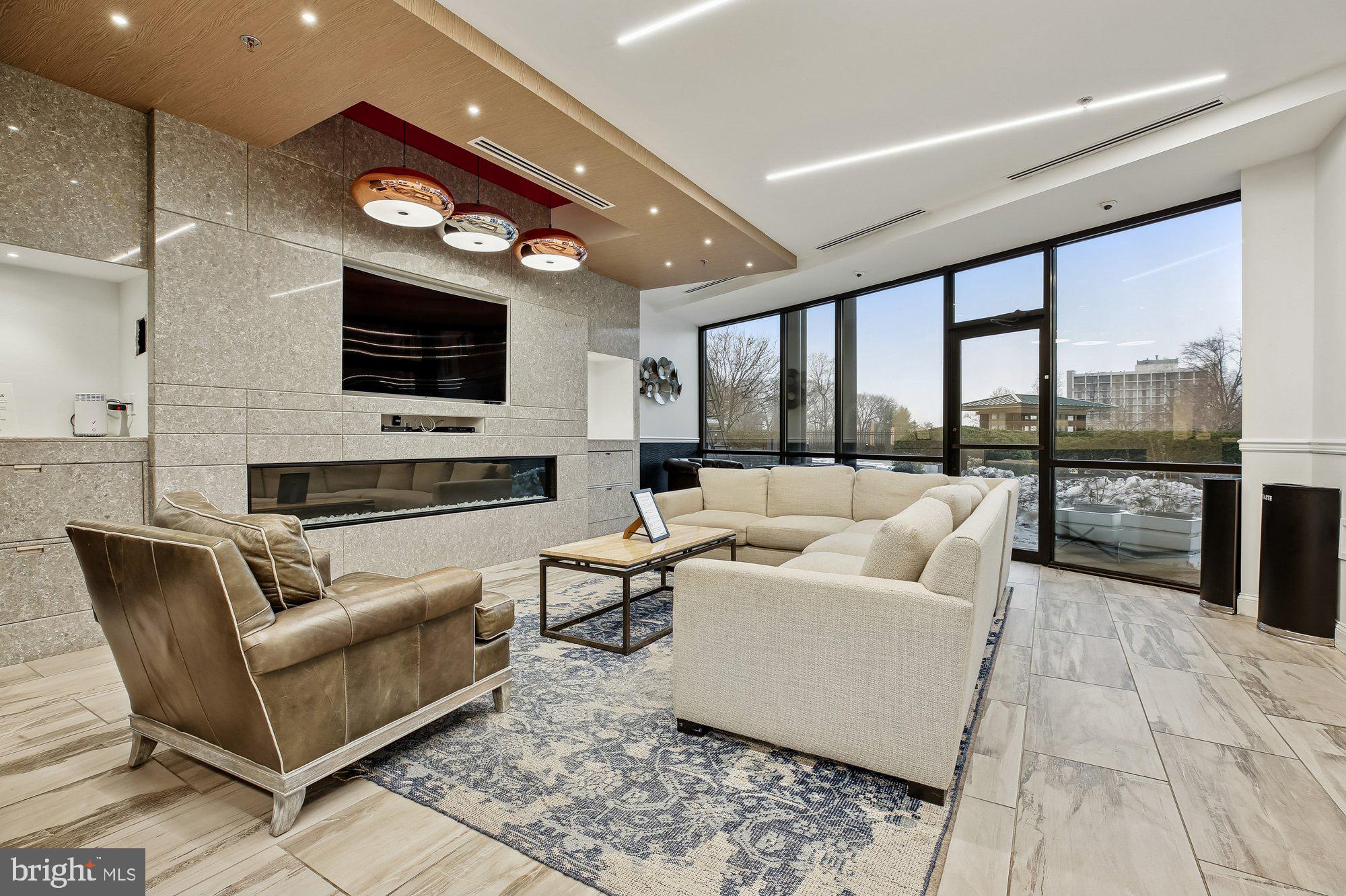 5225 Pooks Hill Road, Unit 629S Bethesda, MD 20814 - Photo 33 of 58 a living room with fireplace furniture and a flat screen tv