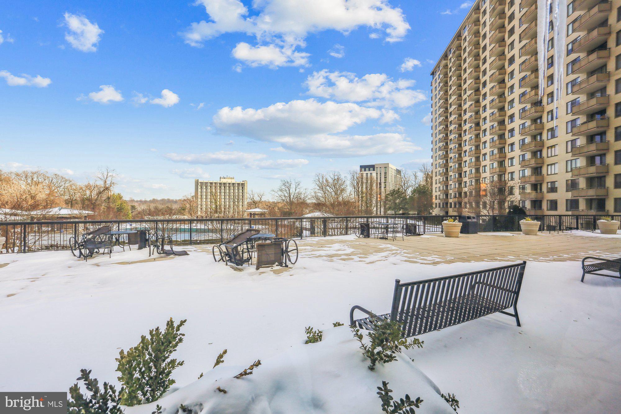5225 Pooks Hill Road, Unit 629S Bethesda, MD 20814 - Photo 49 of 58 a view of a terrace with chairs and iron fence