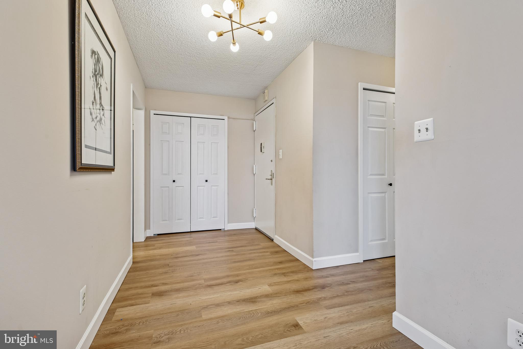 5225 Pooks Hill Road, Unit 629S Bethesda, MD 20814 - Photo 5 of 58 a view of an empty room with wooden floor