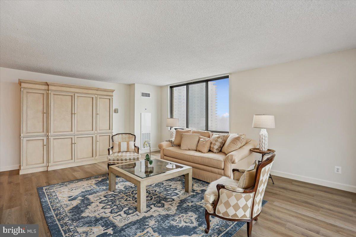 5225 Pooks Hill Road, Unit 629S Bethesda, MD 20814 - Photo 7 of 58 a living room with furniture and wooden floor