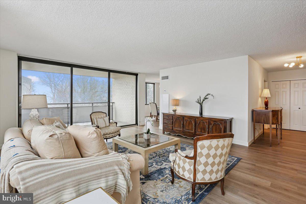 5225 Pooks Hill Road, Unit 629S Bethesda, MD 20814 - Photo 8 of 58 a living room with furniture and a large window