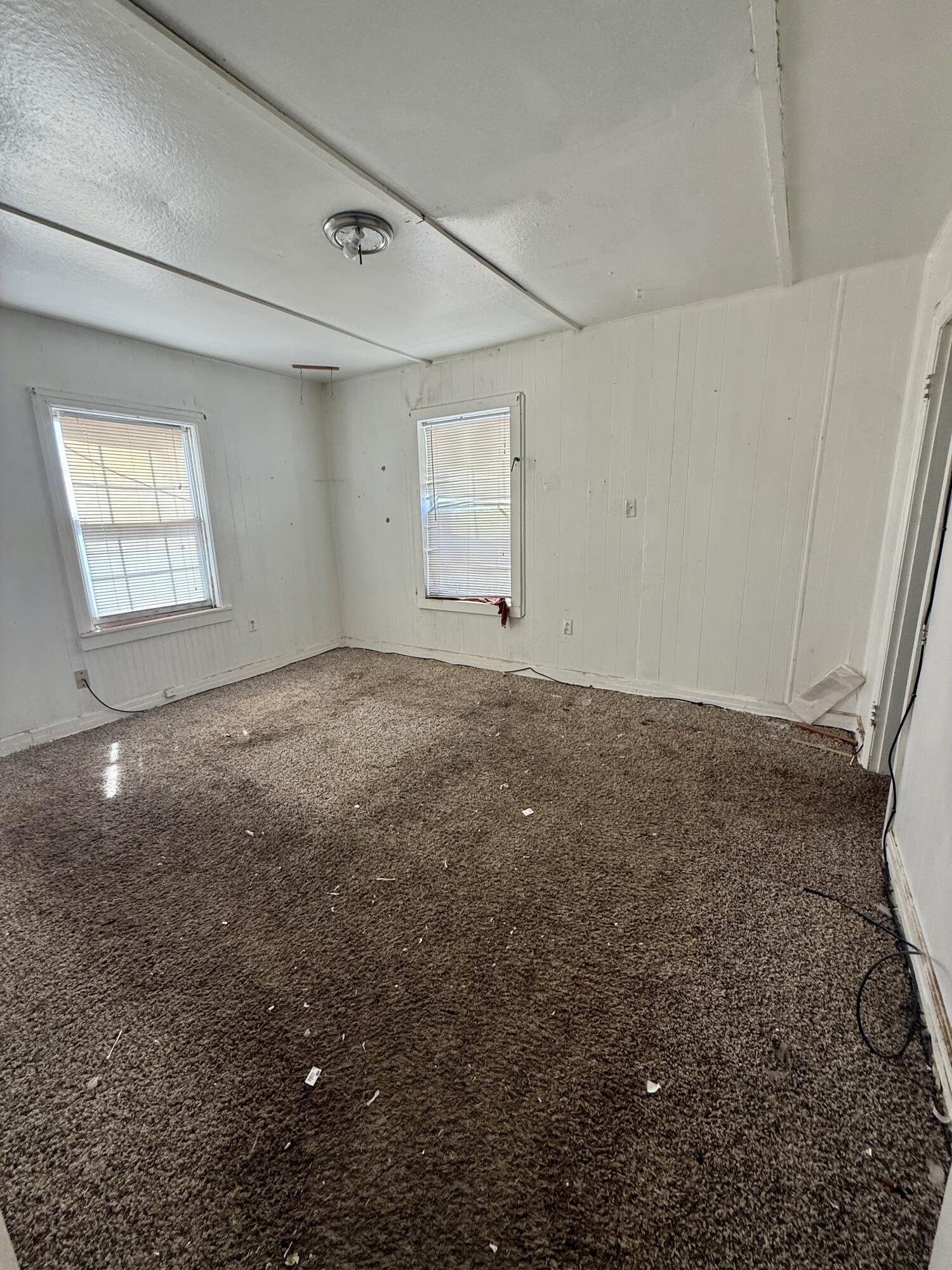 6119 20th Street Lubbock, TX 79407 - Photo 4 of 9 a view of a big room with windows and cabinet