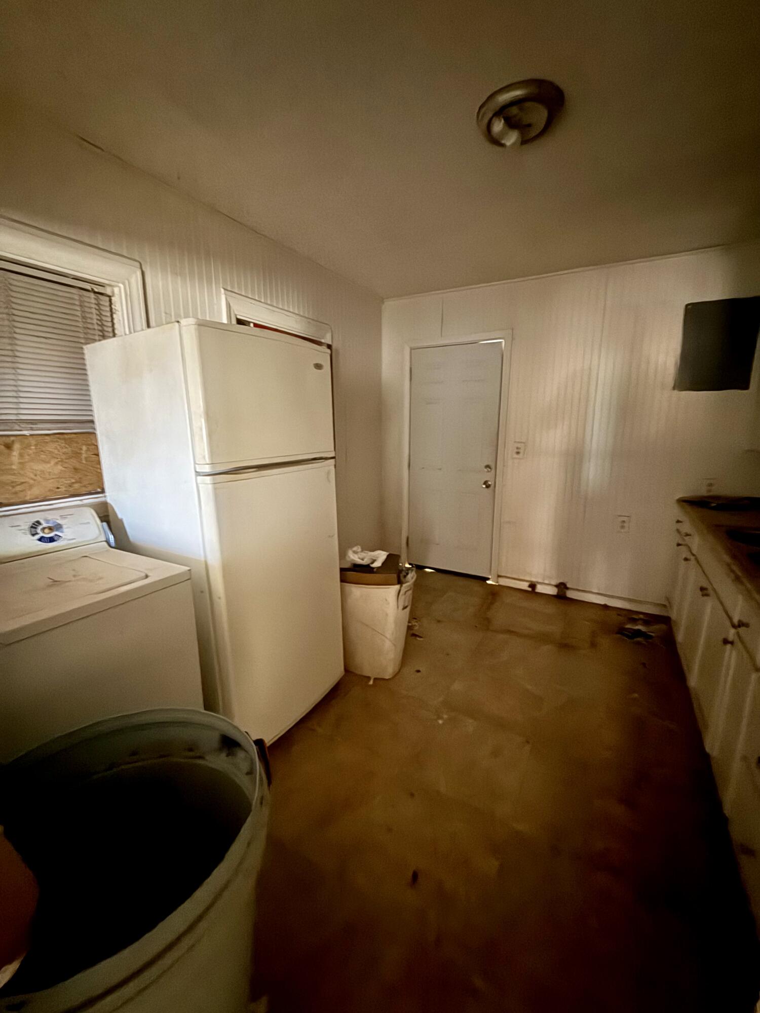6119 20th Street Lubbock, TX 79407 - Photo 7 of 9 a view of a storage and utility room with two washing machine