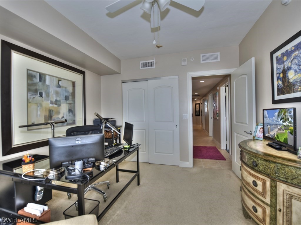 2104 West First Street, Unit 802 Fort Myers, FL 33901 - Photo 14 of 17 a living room with furniture and a flat screen tv