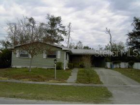 14591 Southwest 34th Terrace Road Ocala, FL 34473 - Photo 1 of 1 a view of a house with a yard