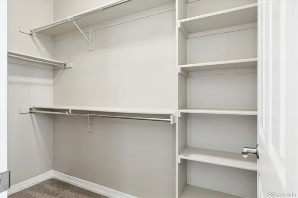a view of an empty walk in closet