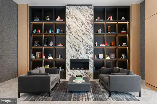 a living room with furniture and a fireplace