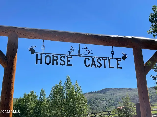 a bed room with a bed and a chair