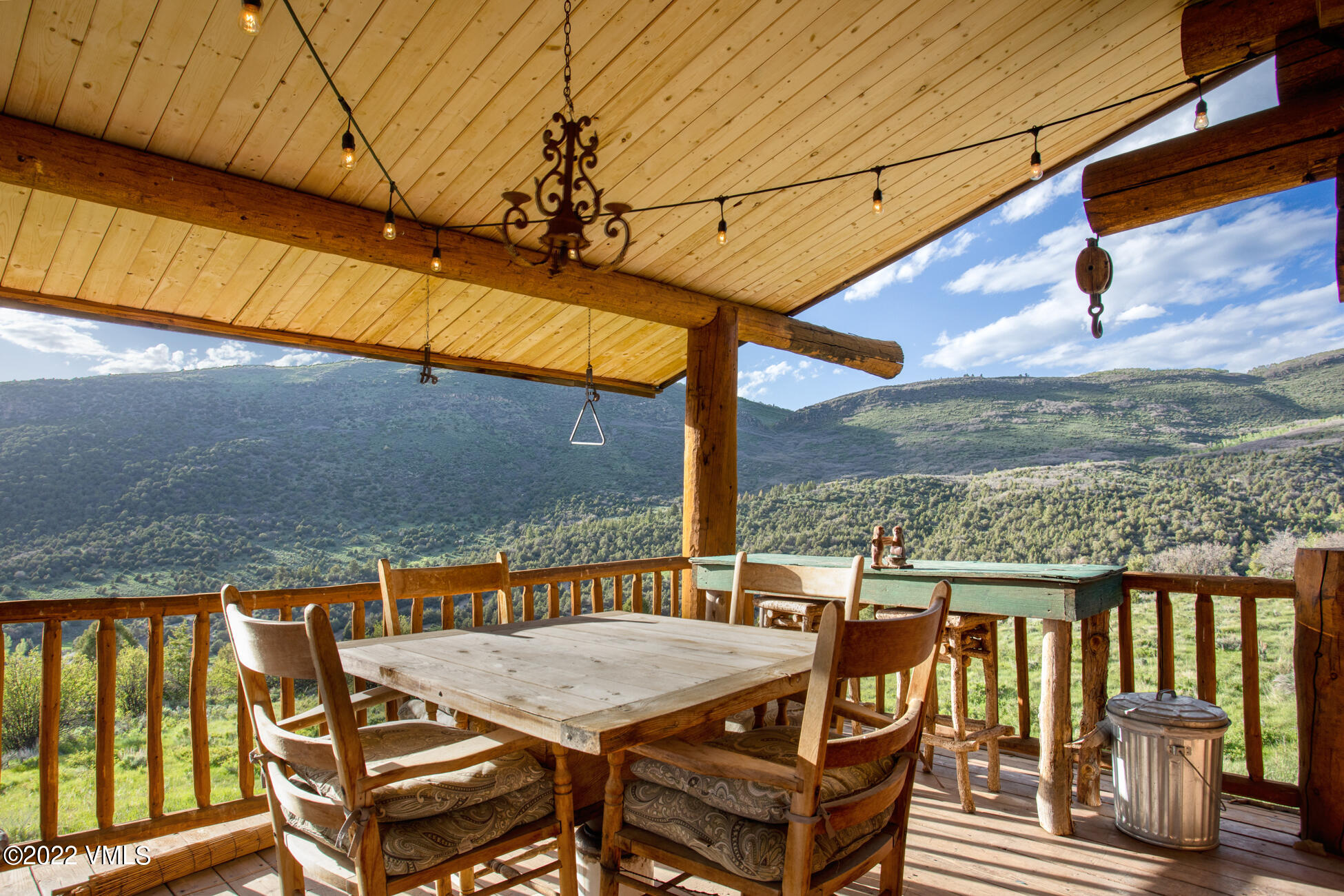 3758 Salt Creek Road Eagle, CO 81631 - Photo 55 of 66 a view of a balcony with table and chairs