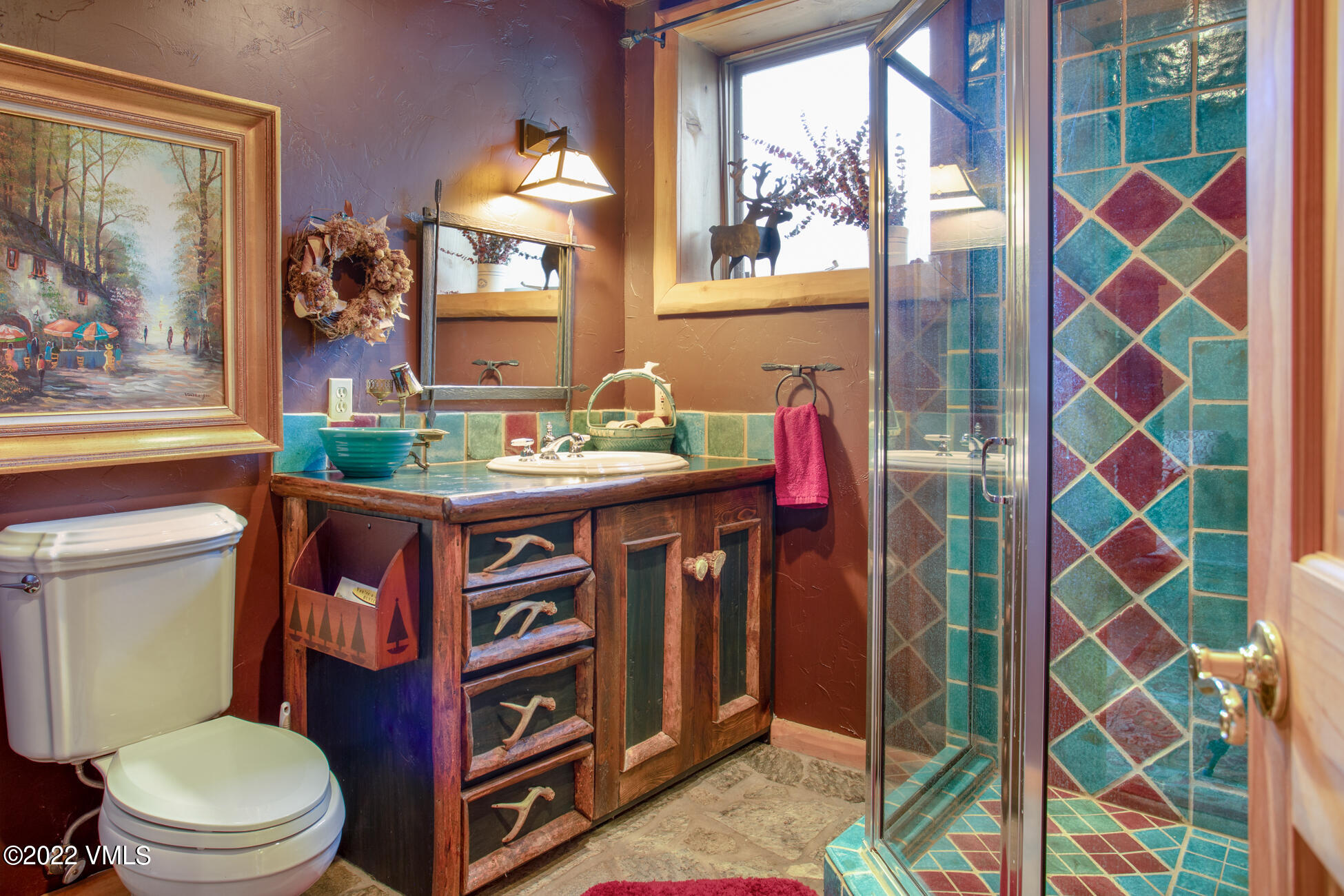 3758 Salt Creek Road Eagle, CO 81631 - Photo 62 of 66 a bathroom with a sink a toilet and a mirror