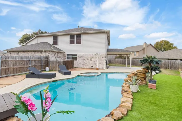 a view of a house with swimming pool