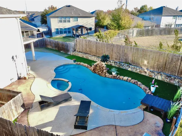 a view of a chairs and table in the patio