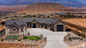 1141 East Lost Ridge Drive Washington, UT 84780 - Photo 21 of 108 Contemporary ranch-style residence featuring a paved driveway, integrated garage, and a separate detached garage structure