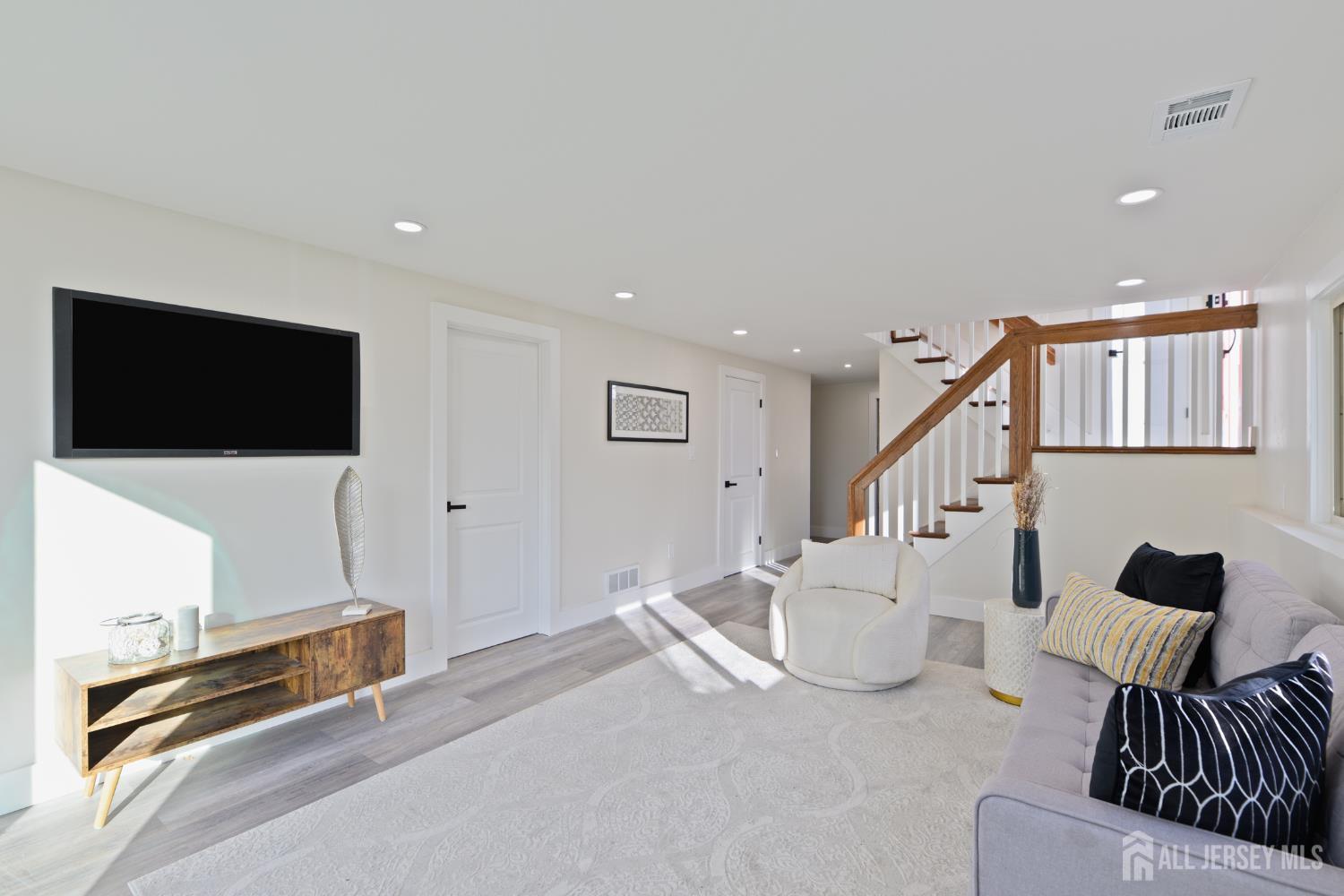 17 Wellington Road East Brunswick, NJ 08816 - Photo 19 of 23 a living room with furniture and a flat screen tv