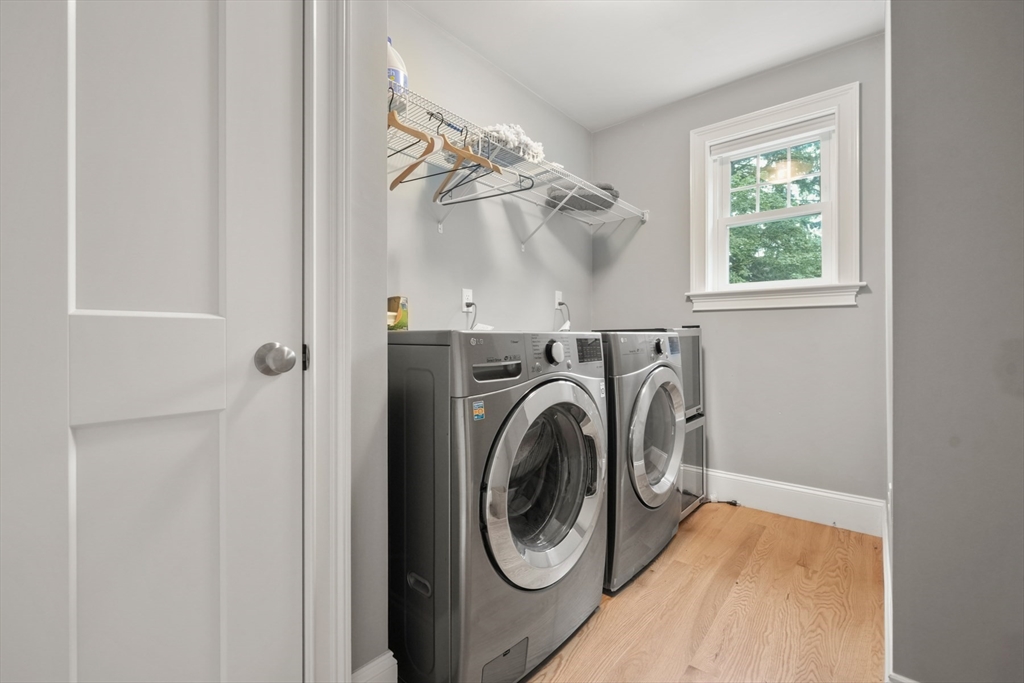 26 Brookfield Road Waltham, MA 02452 - Photo 15 of 37 a view of a hallway with washer and dryer