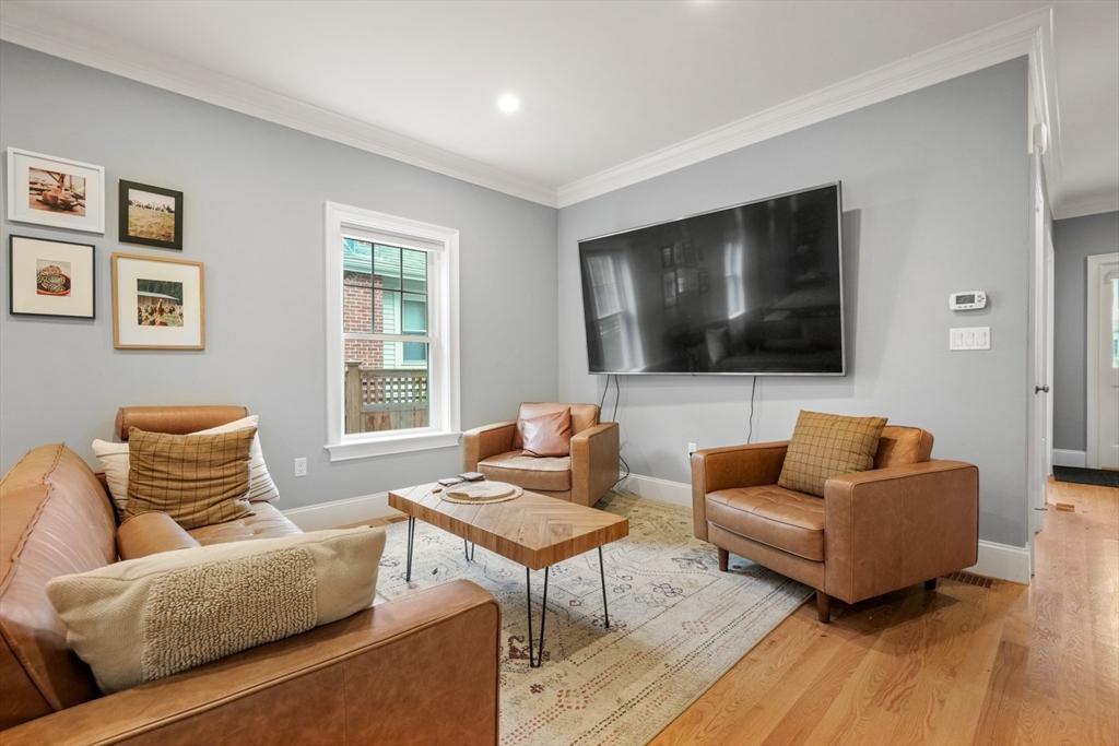 26 Brookfield Road Waltham, MA 02452 - Photo 16 of 37 a living room with furniture and a flat screen tv