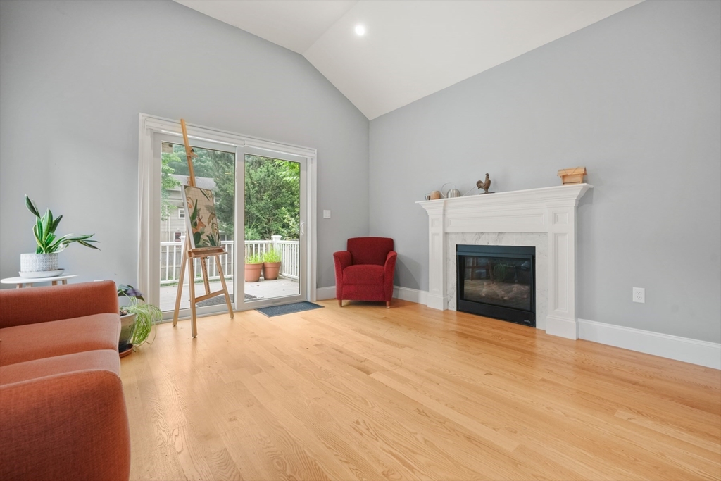 26 Brookfield Road Waltham, MA 02452 - Photo 18 of 37 a living room with furniture and a fireplace