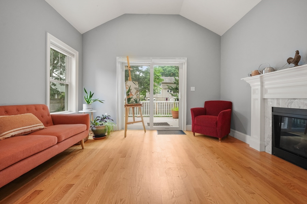 26 Brookfield Road Waltham, MA 02452 - Photo 19 of 37 a living room with furniture and a fireplace