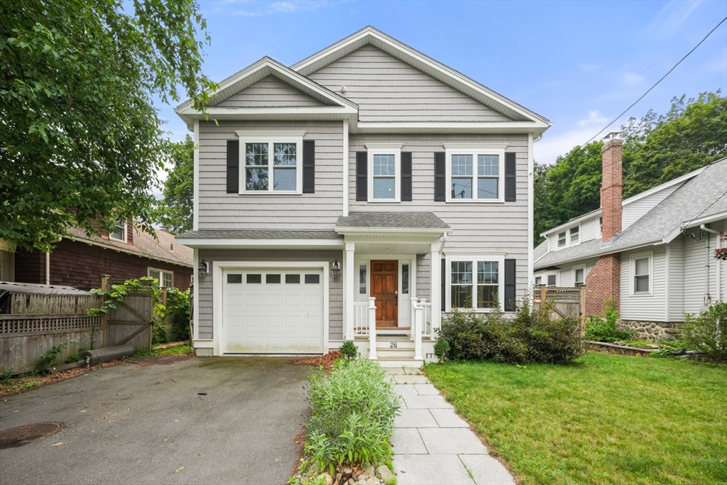 26 Brookfield Road Waltham, MA 02452 - Photo 2 of 37 a view of a white house next to a yard and a large tree