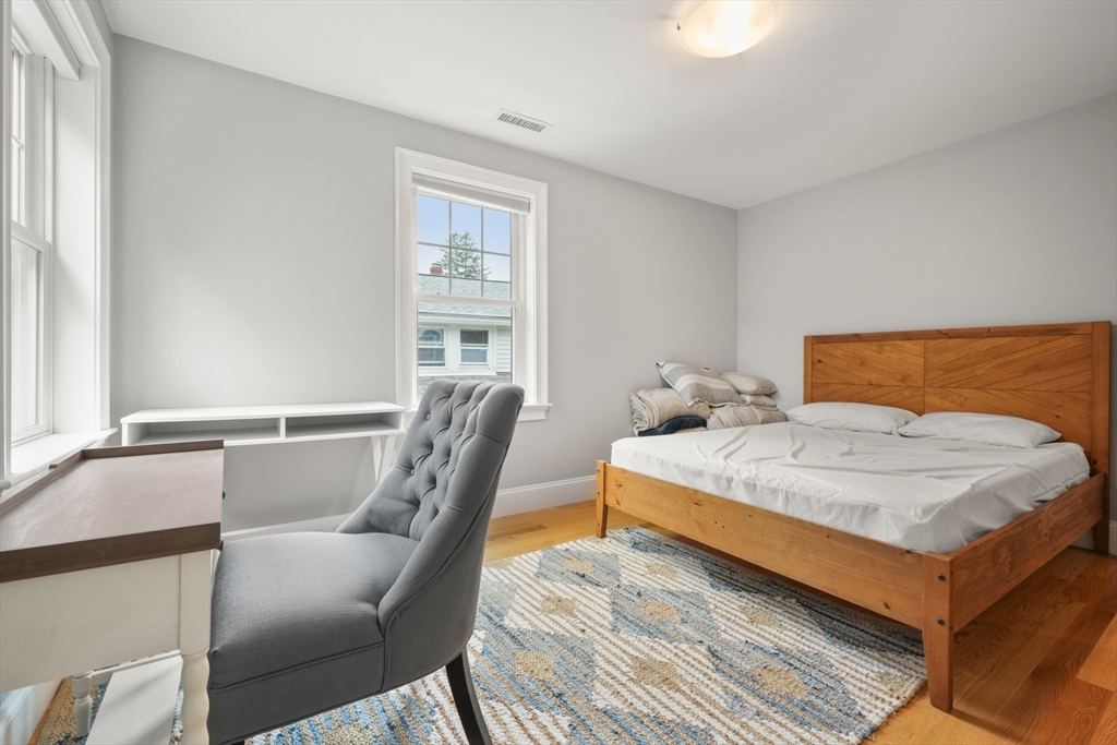 26 Brookfield Road Waltham, MA 02452 - Photo 24 of 37 a bedroom with a bed chair and window