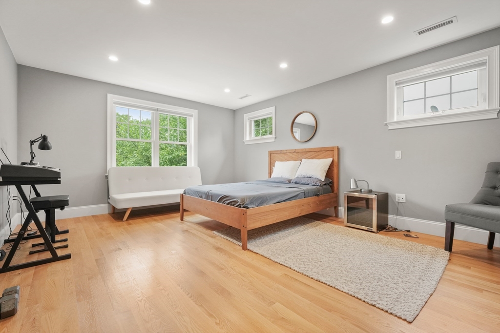 26 Brookfield Road Waltham, MA 02452 - Photo 25 of 37 a bedroom with a bed and a table in it