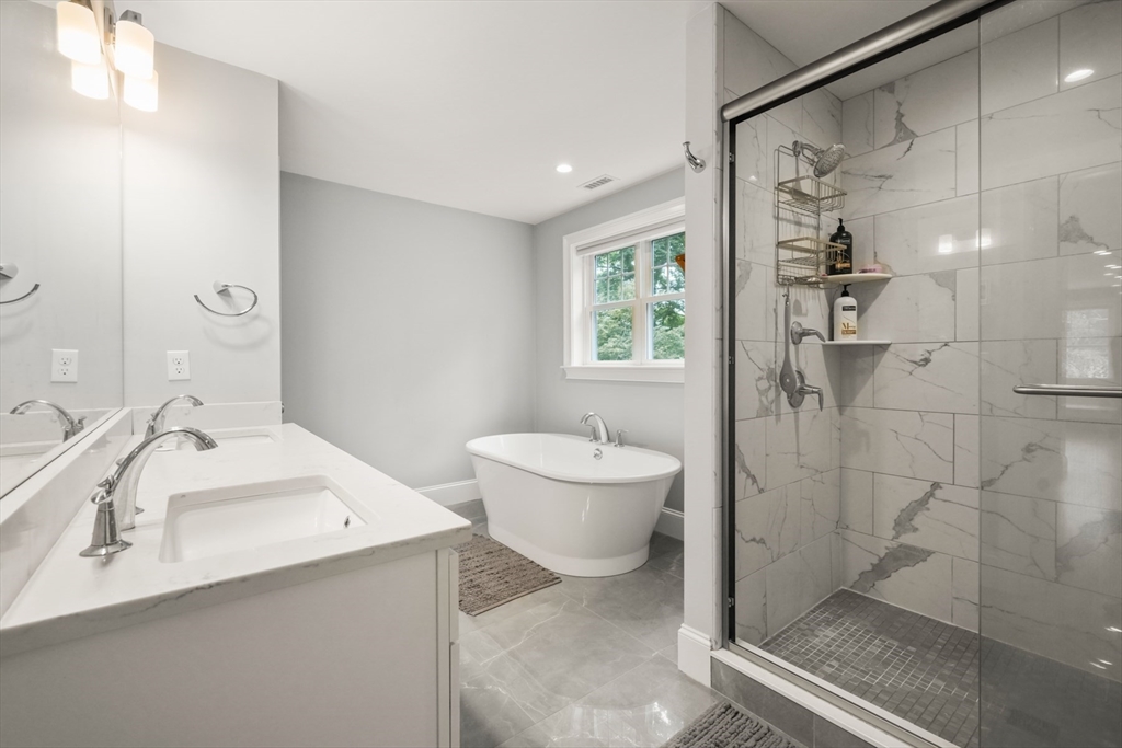 26 Brookfield Road Waltham, MA 02452 - Photo 26 of 37 a bathroom with a granite countertop sink a toilet and shower