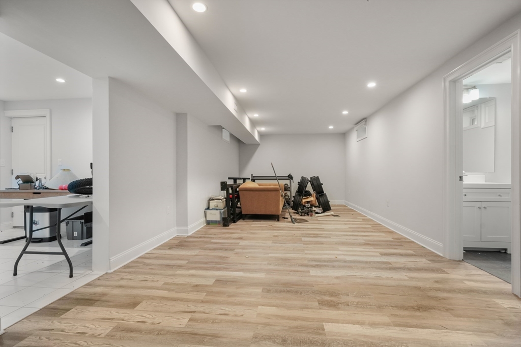 26 Brookfield Road Waltham, MA 02452 - Photo 35 of 37 a bed room with a bed and a chair