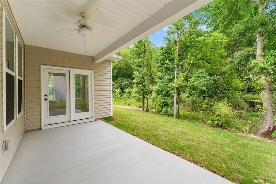 705 Weathered Oak Way Anderson, SC 29621 - Photo 46 of 47 This private patio retreat offers seamless indoor-outdoor living with lush green views.