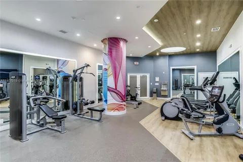 a view of a room with furniture and window