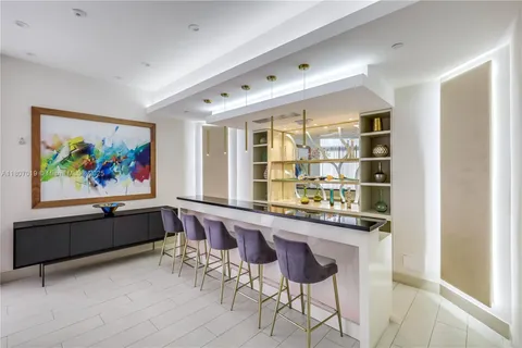 a living room with furniture and a large mirror