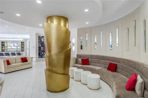 a view of swimming pool with outdoor seating and plants