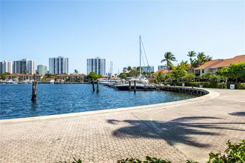a swimming pool with outdoor seating and yard