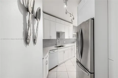 a kitchen that has a sink and a stove