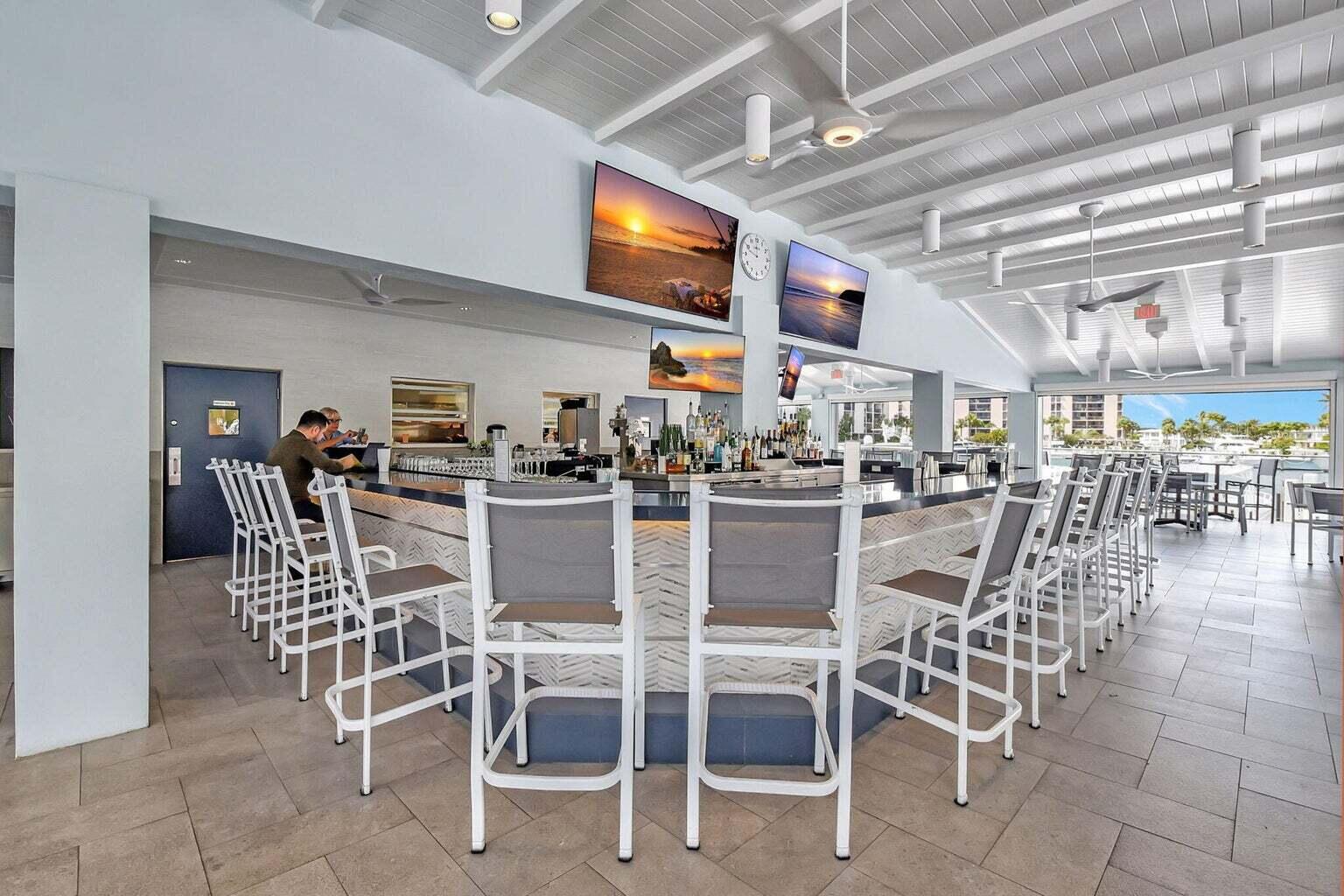 2707 North Ocean Boulevard, Unit D205 Boca Raton, FL 33431 - Photo 32 of 51 a dining area with lots of table and chairs