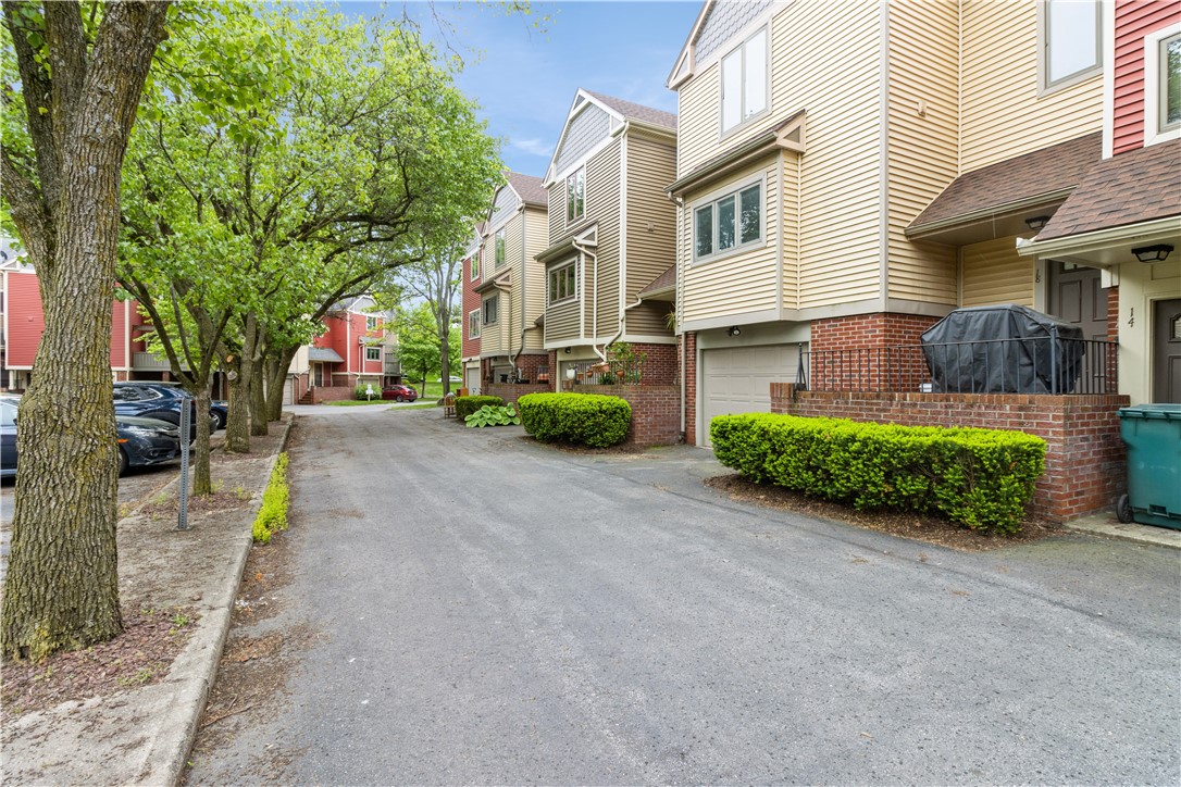 26 Cornhill Place Rochester, NY 14608 - Photo 23 of 24 Rear of Townhouse with open parking spots