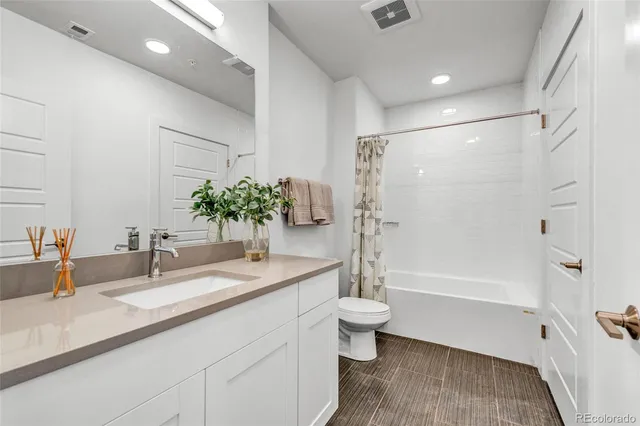 a kitchen with a sink and refrigerator