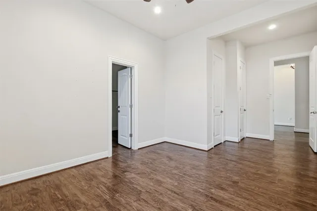 an empty room with wooden floor
