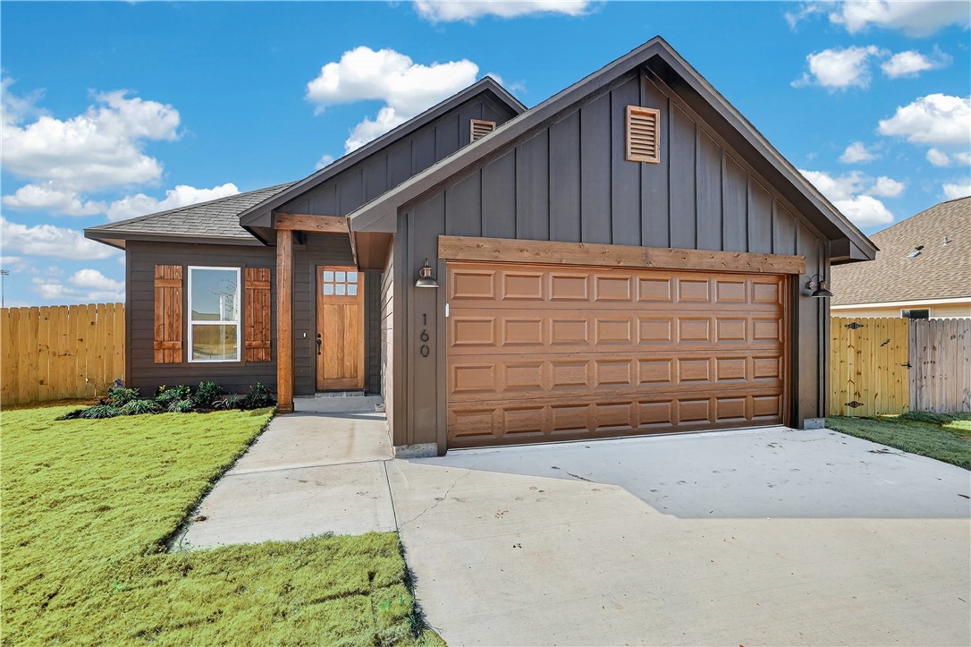 a view of backyard of house with garage