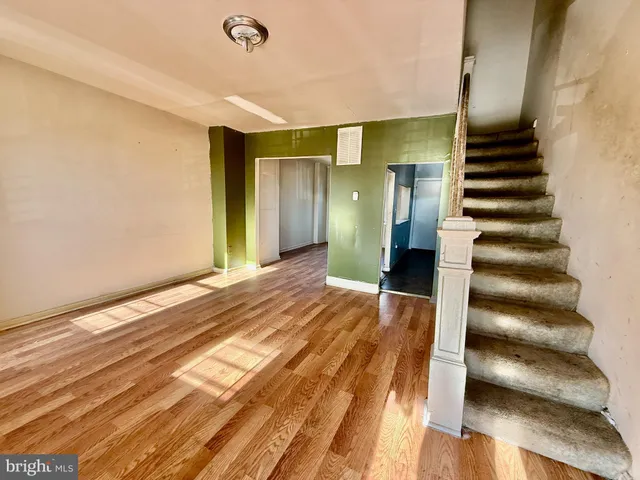 a view of entryway with wooden floor