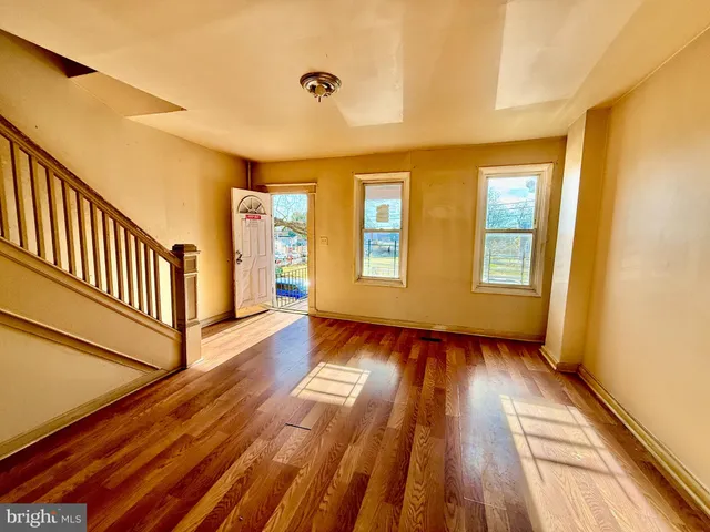a view of entryway with wooden floor