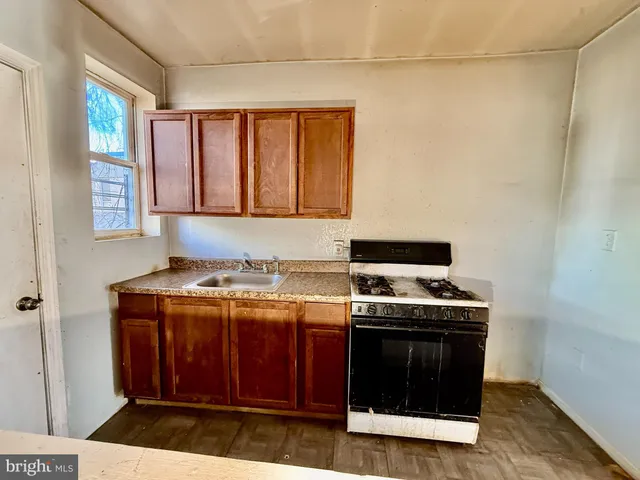 a kitchen with a stove and a cabinet