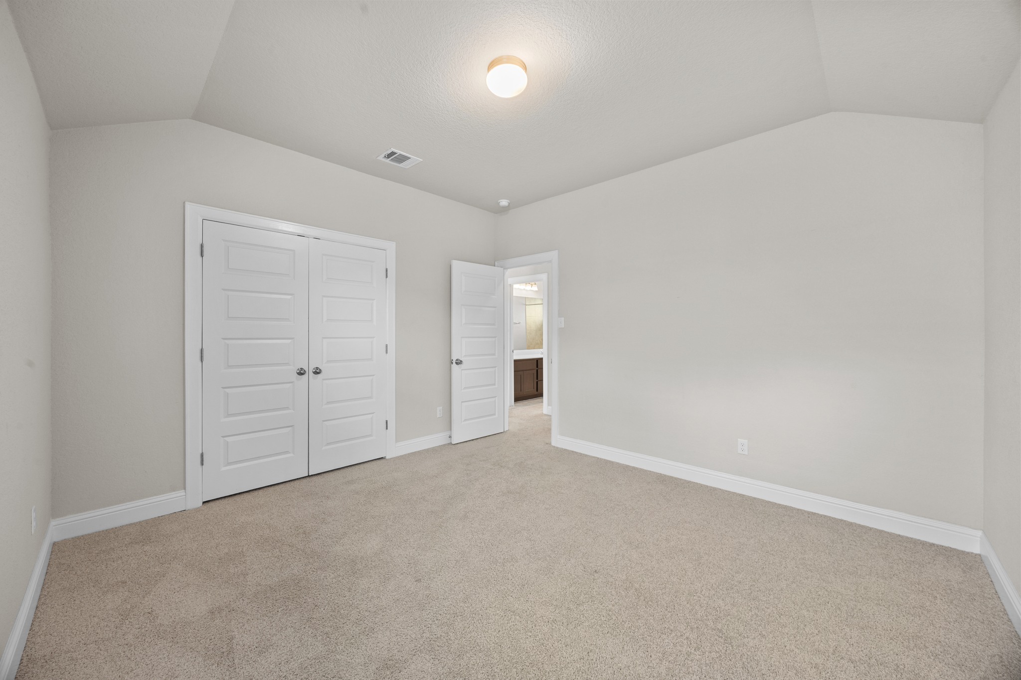 213 Graver Street Georgetown, TX 78626 - Photo 28 of 33 Soft carpeted floors invite comfort in this airy bedroom with a spacious closet.