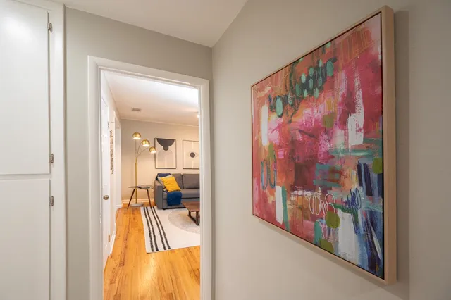 a view of a hallway with bathroom