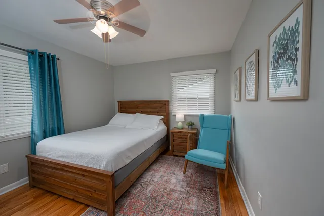 a bedroom with a bed and window