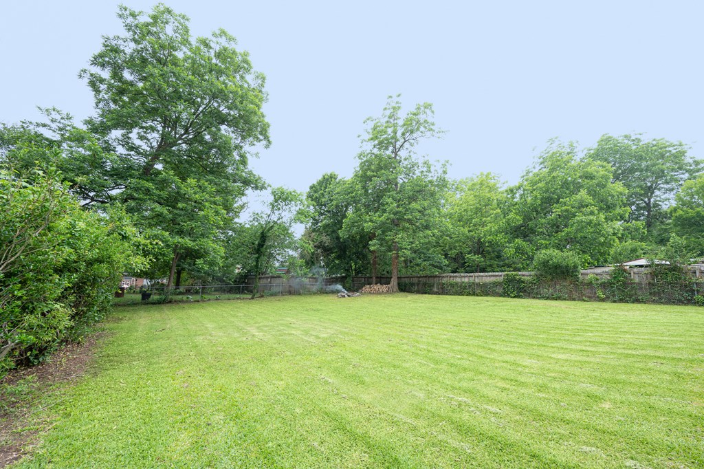3828 Reese Road Columbus, GA 31907 - Photo 7 of 45 a view of a swimming pool and trees in the background