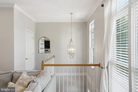 a view of a livingroom with furniture and windows