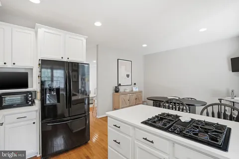 a kitchen with a stove and a refrigerator