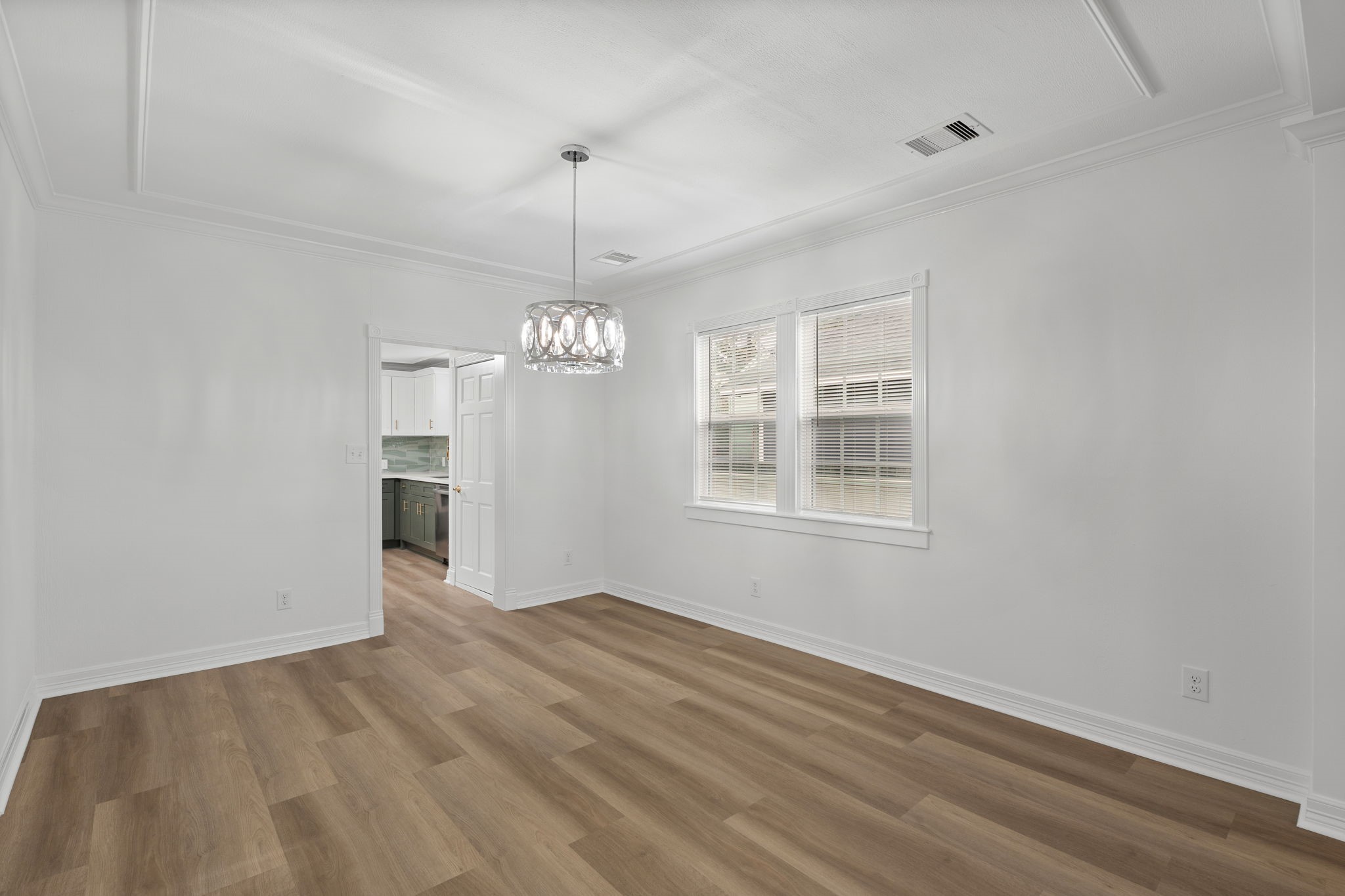 203 Archer Street Houston, TX 77009 - Photo 16 of 43 a view of empty room with wooden floor and ceiling fan
