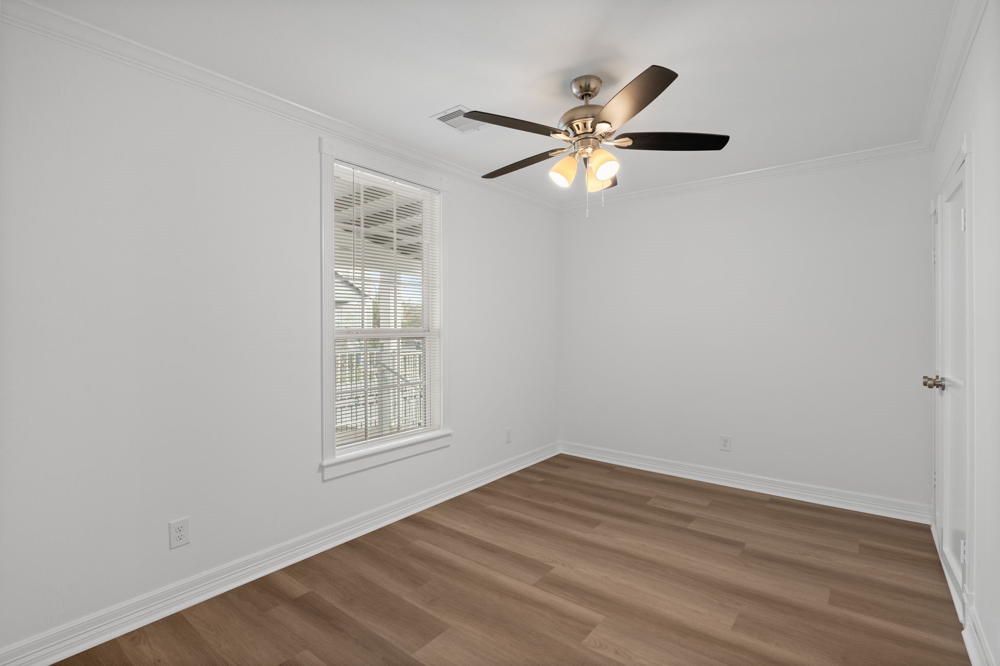 203 Archer Street Houston, TX 77009 - Photo 23 of 43 a view of empty room with wooden floor and fan