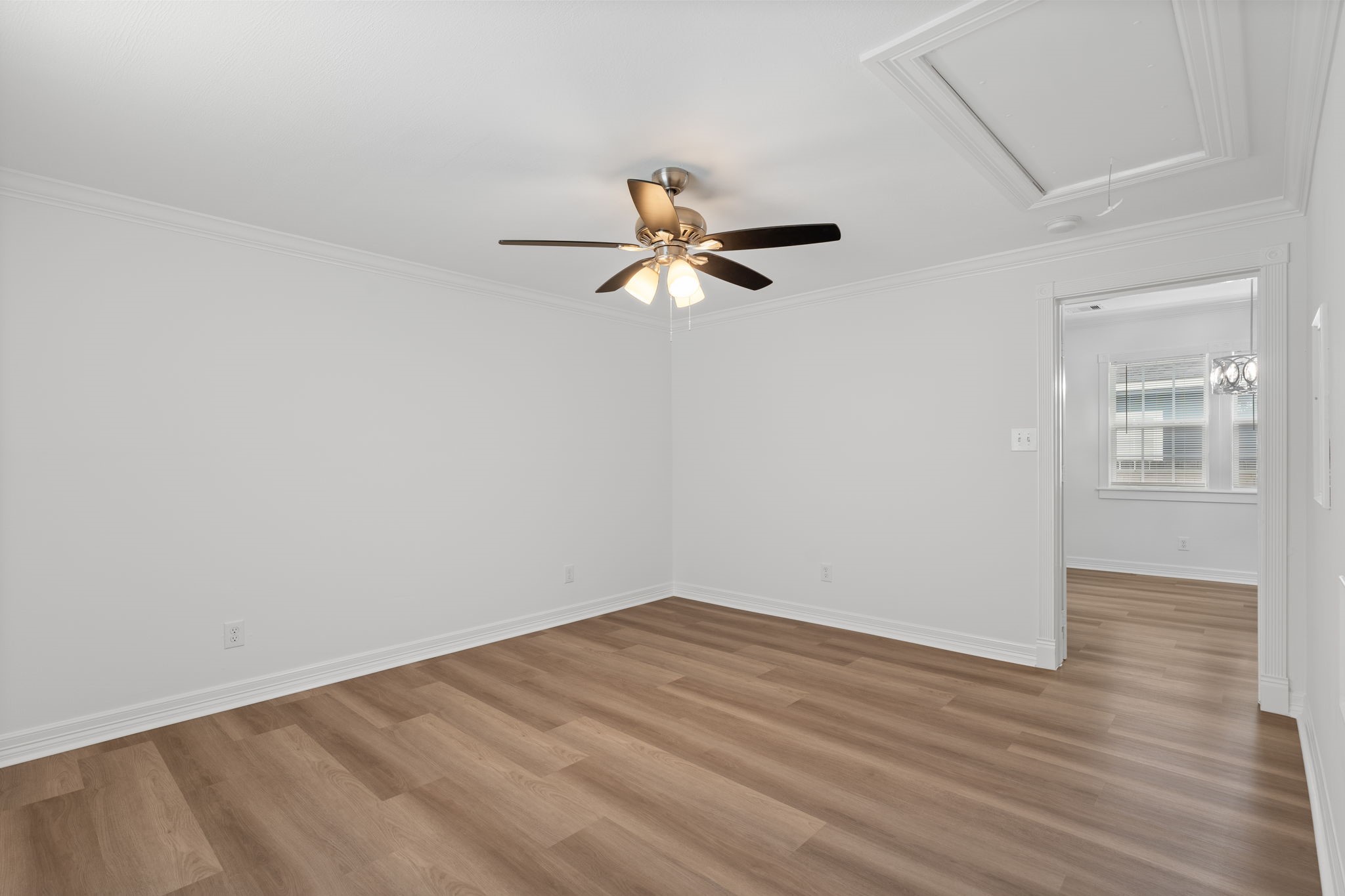 203 Archer Street Houston, TX 77009 - Photo 27 of 43 wooden floor in an empty room with a window